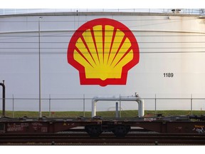 Railway wagon bogies beside a Royal Dutch Shell Plc logo on an oil silo at the Shell Pernis refinery in Rotterdam, Netherlands, on Tuesday, April 27, 2021. Shell reports first quarter earnings on April 29. Photographer: Peter Boer/Bloomberg