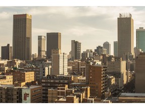 Commercial properties, residential buildings and skyscraper offices on the skyline viewed from a rooftop bar in Johannesburg, South Africa, on Thursday, May 21, 2021. Traders raised bets that South Africa's central bank will tighten policy this year after inflation accelerated more than expected, resulting in a negative real interest rate for the first time in more than five years. Photographer: Guillem Sartorio/Bloomberg