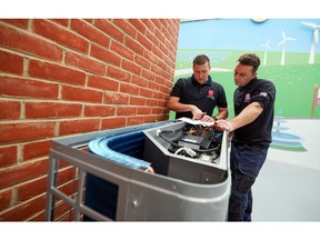 Engineers work on installing an Ecoforest heat pump at the Octopus Energy Ltd.'s training and R&D centre in Slough, U.K., on Tuesday, Sept. 28, 2021. Octopus, backed by Al Gore's sustainability fund, is helping teach the plumbers to install heat pumps that will play a pivotal role in the U.K.'s strategy to have net-zero emissions by 2050.