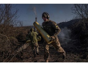Ukrainian soldiers fire towards Russian positions in Donetsk Oblast, Ukraine. Photographer: Bulent Kilic/AFP/Getty Images