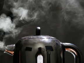 KNUTSFORD, UNITED KINGDOM - FEBRUARY 03: In this photo illustration a domestic electric kettle emits steam and vapour on February 07, 2022 in Knutsford, United Kingdom. The energy regulator OFGEM has brought forward the announcement of the increase in the energy price cap to reflect the record high gas energy market prices caused by the global crisis in supply.
