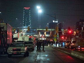 Protesters block access to the Ambassador Bridge in Windsor, Ont. on Feb. 11, 2022.