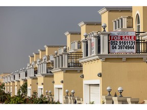 A 'For Sale' sign on a residential villa in the Jumeirah Park district of Dubai, United Arab Emirates, on Wednesday, Feb. 23, 2022. A government committee set up before the pandemic enlisted some of Dubai's largest developers as members to try to manage supply and demand in the property market and ensure that state-owned businesses don't crowd out private builders.
