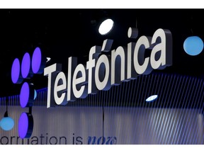 An illuminated logo above the Telefonica SA stand on the opening day of MWC Barcelona at the Fira de Barcelona venue in Barcelona, ​​Spain, Monday, February 28, 2022. More than 1,800 exhibitors and attendees from 183 countries will attend the annual event, which runs from February 28 to March 3.  Photographer: Angel Garcia/Bloomberg