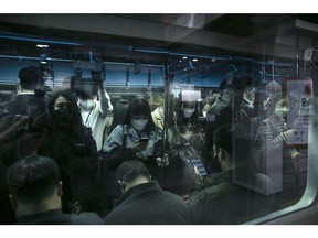 Morning commuters on a subway in Seoul, South Korea, on Monday, April 18, 2022. Starting Monday, there is no social distancing rules except for wearing masks, culminating the country's drive to "return lives to normal" with a strategy that has stood out for preventing an economic downturn while keeping the death rate relatively low. Photographer: Woohae Cho/Bloomberg