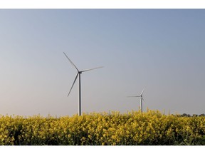 Wind turbines in fields of canola in Boissy-La-Rivire, France, on Tuesday, May 3, 2022. Electricite de France SA's (EDF) falling nuclear production, combined with Russia's invasion of Ukraine, is exacerbating Europe's energy crisis as France is traditionally a net exporter of electricity.