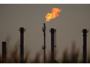 A flare stack burns at the natural gas storage facility operated by Astora GmbH & Co KG, one of the largest in Western Europe and formerly controlled by Gazprom Germania GmbH, in Rehden, Germany, on Tuesday, Aug. 23, 2022. Astora, a former unit of Gazprom Germania GmbH now named SEFE Securing Energy for Europe GmbH, is seeking relief from a levy to share the burden of higher gas prices with consumers, according to a person familiar with the situation. Photographer: Krisztian Bocsi/Bloomberg