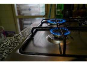 Gas rings burn on a domestic hob in a residential apartment in Madrid, Spain, on Wednesday, Sept. 7, 2022. Spain is considering ways to encourage a cleaner, more efficient type of natural gas-fired generation technology in energy market rules designed to contain soaring fuel costs.