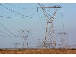 High voltage electricity transmission towers in Mpumalanga, South Africa on Thursday, Sept. 29, 2022. South Africa relies on coal to generate more than 80% of its electricity, and has been subjected to intermittent outages since 2008 because state utility Eskom Holdings SOC Ltd. can't meet demand from its old and poorly maintained plants. Photographer: Waldo Swiegers/Bloomberg