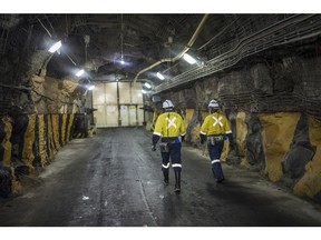 Mine workers walk through a tunnel at the Gold Fields Ltd. South Deep gold mine in Westonaria, South Africa, on Wednesday, Oct. 12, 2022. Gold Fields will seek shareholder approval next month for its acquisition of Canadas Yamana, which owns about 56% of the giant Mara project in Argentina.