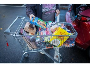 A customer packs shopping into the boot of a car at an Aldi Stores Ltd. supermarket in Sheffield, UK, on Saturday, Oct. 15, 2022. The Office for National Statistics are due to release the latest UK CPI Inflation data on Wednesday.