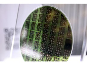 A Hon Young Semiconductor Corp. wafer on display at a Foxconn Technology Group event in Taipei, Taiwan, on Tuesday, Oct. 18, 2022. Foxconn Technology Group took the wraps off two new electric vehicles on Tuesday, prototypes that embody the iPhone maker's ambitions of carving out a slice of a market now dominated by Tesla Inc. Photographer: I-Hwa Cheng/Bloomberg