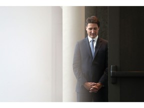 Prime Minister Justin Trudeau waits back stage before speaking at the Ottawa Climate Conference in Ottawa earlier this month. His government releases its economic update today.