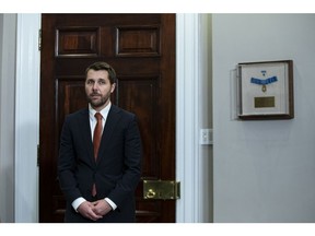 Brian Deese, director of the National Economic Council, listens as US President Joe Biden, not pictured, speaks in the Roosevelt Room of the White House in Washington, DC, U.S., on Wednesday, Oct. 19, 2022. The Biden administration plans to release 15 million barrels from US emergency reserves, and may consider significantly more this winter, in an effort to ease high gasoline prices that have become a liability for Democrats in next month's midterm elections.