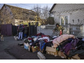 People sift though donated clothes at aid distribution point in Chernihiv, Ukraine. on October 31, 2022. Photographer: Ed Ram/Getty Images