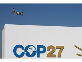 A passenger aircraft floes over the COP27 climate conference venue in Sharm El-Sheikh, Egypt, on Sunday, Nov. 6, 2022. Disagreements over who should pay for the harm done by climate-driven extreme weather events will be at the heart of discussions at COP27, the first to be held in Africa since 2016.