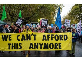 Protesters march during the 'Britain Is Broken' rally organized by The People's Assembly Against Austerity, in London, UK, on Saturday, Nov. 5, 2022. T