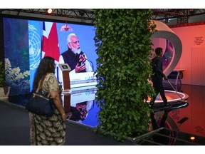 A screen broadcasts India's Prime Minister Narendra Modi at the India pavilion at the COP27 climate conference at the Sharm El Sheikh International Convention Centre in Sharm El-Sheikh, Egypt, on Tuesday, Nov. 8, 2022. More than 100 world leaders are set to be in Sharm el-Sheikh, Egypt over the next two weeks for the UN's annual climate talks.