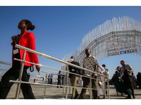 Attendees arrive at the COP27 climate conference at the Sharm El Sheikh International Convention Centre in Sharm El-Sheikh, Egypt, on Tuesday, Nov. 8, 2022. More than 100 world leaders are set to be in Sharm el-Sheikh, Egypt over the next two weeks for the UN's annual climate talks.