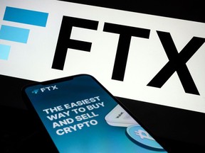 LONDON, ENGLAND - NOVEMBER 10: In this photo illustration the FTX logo and mobile app adverts are displayed on screens on November 10, 2022 in London, England. The Bahamas-based crypto exchange's larger rival, Binance, walked away from a potential bailout deal, as FTX struggles with a wave of customer withdrawals that have created a liquidity crunch.