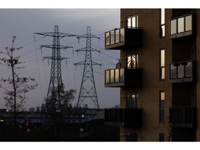 Residential apartments next to electricity pylons on the Barking Riverside development in London, UK, on Wednesday, Nov. 23, 2022. Barking and Dagenham is the only remaining London borough where house prices in the resale market have risen by double digits. Photographer: Chris Ratcliffe/Bloomberg