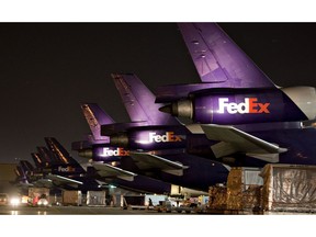FedEx aircraft sit on the tarmac at the FedEx Express hub at Memphis International Airport in Memphis, Tennessee.