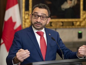 Minister of Transport Omar Alghabra speaks with members of the media after tabling legislation in the House of Commons, Thursday, Nov. 17, 2022 in Ottawa.