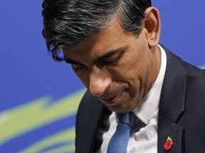 FILE - The then Chancellor of the Exchequer Rishi Sunak arrives for a speech at the COP26 U.N. Climate Summit in Glasgow, Scotland, Wednesday, Nov. 3, 2021. U.K. Prime Minister Rishi Sunak has reversed an earlier decision not to attend the U.N. climate summit in Egypt. Sunak's office previously said he had to skip the talks which start on Sunday, Nov. 6, 2022 because of "pressing domestic commitments" including the closely-watched government budget statement, expected to be announced on Nov. 17.