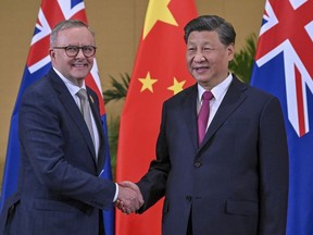 Australian Prime Minister Anthony Albanese, left, meets Chinese President Xi Jinping on the sidelines of the G-20 summit in Nusa Dua, Bali, Indonesia, Tuesday, Nov. 15, 2022. Albanese met with Chinese President Xi Jinping for the first face-to-face talk between the nations' leaders in five years.