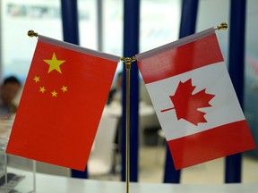 Chinese and Canadian national flags are seen during an exhibition in Shanghai, China.