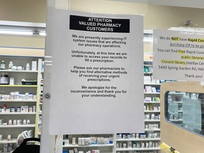 A sign for pharmacy customers is shown at a Lawtons Drugs in Halifax on Tuesday Nov. 8, 2022. Empire Co. Ltd. remains tight-lipped about the computer system issues that are still posing a challenge for customers seeking prescriptions at some of the pharmacies operated by Nova Scotia-based Empire Co. Ltd.