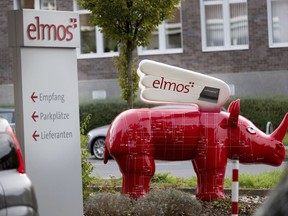 FILE - A winged 'Elmos rhinoceros' stands in front of the chip factory Elmos Semiconductor SE offices in Dortmund, Germany, on Nov. 8, 2022. China's government on Wednesday, Nov. 9, appealed to Germany to maintain access to its markets after the company said Berlin may block the sale of a computer chip factory to a Chinese-owned buyer amid tensions over technology and security.