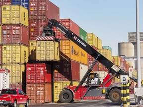 Containers are stacked at the Port of Montreal. Statistics Canada says real gross domestic product grew at an annual rate of 2.9 per cent in the third quarter.