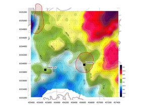 Bouguer gravity after terrain corrections. Red shaded areas represent surface uranium anomalies (uranium content >2.345 ppm) from the airborne gamma-ray spectrometric survey (Ford et al., 2006), and black squares represent surface radioactive anomalies discovered in Phase 1 of the fall program.