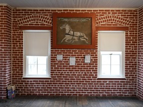 A drawing of a single buggy harness hangs on a wall in a museum at the former Genoa Indian Industrial School, Thursday, Oct. 27, 2022, in Genoa, Neb. For decades the location of the student cemetery, where over 80 Native American children are buried, has been a mystery, lost over time after the school closed in 1931 and memories faded of the once-busy campus that sprawled over 640 acres in the tiny community of Genoa.