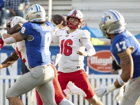 Western Kentucky quarterback Austin Reed (16) throws a pass against Middle Tennessee State during an NCAA college football game Saturday, Oct. 15, 2022, in Murfreesboro, Tenn.