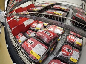 FILE - Ground Beef is on display in a market in Pittsburgh on Tuesday, July 12, 2022. A class-action federal lawsuit is accusing 11 of the United States' largest beef and pork producers of conspiring to depress wages and benefits for its workers. The lawsuit was filed in federal court in Denver last week.