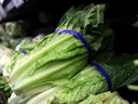 Romaine lettuce is displayed on a supermarket shelf.  The price of the green salad has risen steeply in Canada due to a shortage of imports from California, where the crop this fall has been hit by disease.