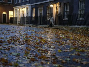 Fallen leaves lie in Downing Street in London, Thursday, Nov. 17, 2022. Just three weeks after taking office, British Prime Minister Rishi Sunak faces the challenge of balancing the nation's budget while helping millions of people slammed by a cost-of-living crisis. Treasury chief Jeremy Hunt will deliver the government's plan for tackling a sputtering economy in a speech to the House of Commons on Thursday.