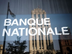 National Bank of Canada profit fell in the fourth quarter as it set aside more money for potential bad loans.