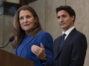 Prime Minister Justin Trudeau looks on as Deputy Prime Minister and Finance Minister Chrystia Freeland speaks in Ottawa.