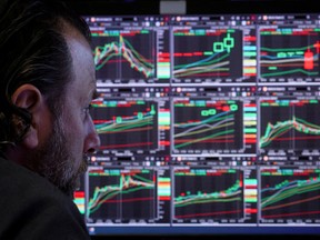 A specialist trader works on the floor of the New York Stock Exchange.