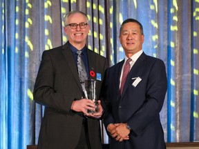 2022 WCGCA Lifetime Achievement Award recipient Stuart McKellar and George Tai, managing partner, Dentons Canada LLP, at the Western Canada General Counsel Awards.