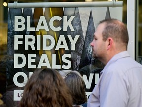 A sign highlighting discounted items as Black Friday sales begin at The Outlet Shoppes of the Bluegrass in Simpsonville, Kentucky.