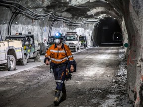A worker walks through a tunnel towards elevators following a shift in the underground mining project at the Oyu Tolgoi copper-gold mine in Khanbogd, the South Gobi desert, in Mongolia.