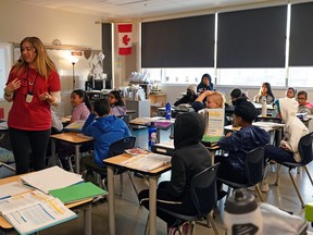 A teacher and students in a classroom at Svend Hansen School in Edmonton.