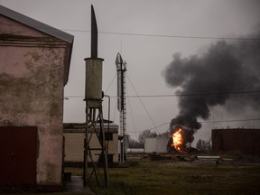 A fire continues to burn at an oil refinery after it was hit overnight by Russian forces in Kherson, Ukraine.