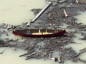 A canoe among the damage caused by a tailings pond breach near the town of Likely, B.C., in 2014.