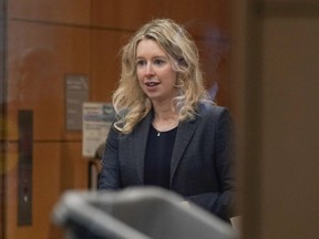 FILE - Former Theranos CEO Elizabeth Holmes arrives at federal court in San Jose, Calif., on Oct. 17, 2022. A federal judge on Friday, Nov. 18, will decide whether Holmes should serve a lengthy prison sentence for duping investors and endangering patients while peddling a bogus blood-testing technology.