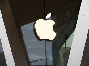 FILE - An Apple logo adorns the façade of the Downtown Brooklyn Apple Store in New York March 14, 2020. Apple will clash with the company behind the popular Fortnite video game in federal appeals court on Monday, November 14, 2022, reviving a high-stakes antitrust battle over whether the digital fortress that protects the iPhone's App Store is illegal. The world's most valuable company prospers while stifling competition.